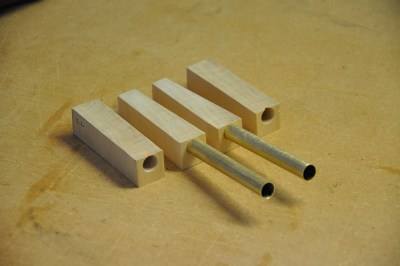 Brass tubes and joiner blocks.